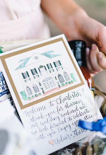 Gift bags full of Charleston, SC specialty products with a watercolor Lowndes Grove card | Charleston-inspired tips to make your destination wedding #1 | Photo by Rach Loves Troy Photo + Cinema